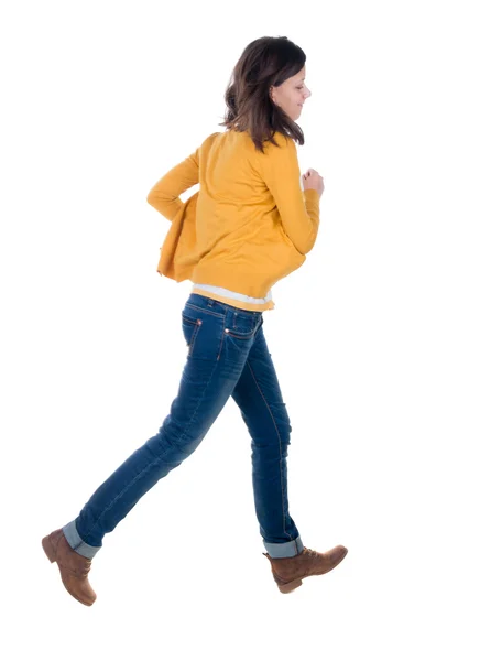 Running woman in yellow cardigan — Stock Photo, Image