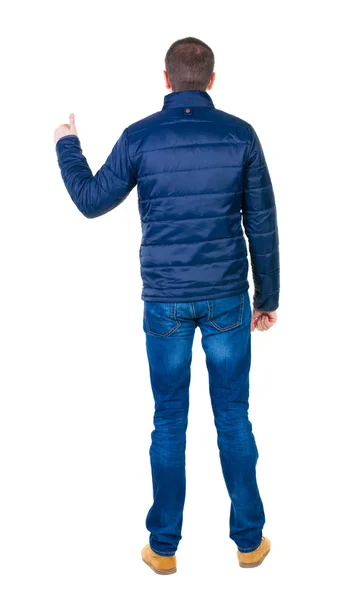 Man in blue jacket shows thumbs up — Stock Photo, Image