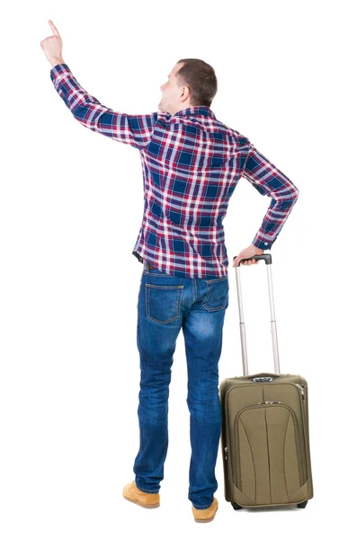 Pointing man with suitcase — Stock Photo, Image
