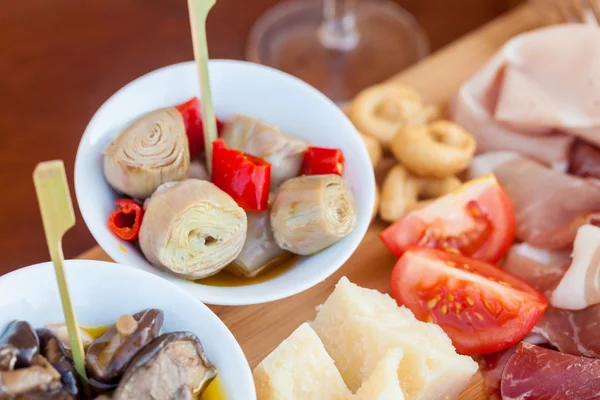 Italian food on chopping board — Stock Photo, Image