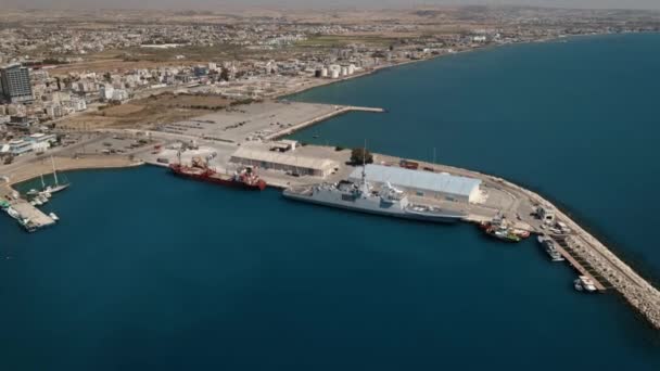 Cargo ships vessels for international logistic moored in harbor port of seaside city or town — Stock Video