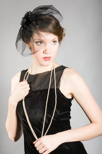 Woman in a black dress retro — Stock Photo, Image