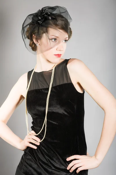 Woman in a black dress retro — Stock Photo, Image