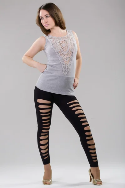 Sexy vrouw in zwarte leggings — Stockfoto