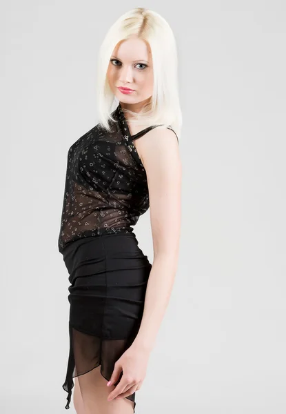 Blonde in a black dress — Stock Photo, Image