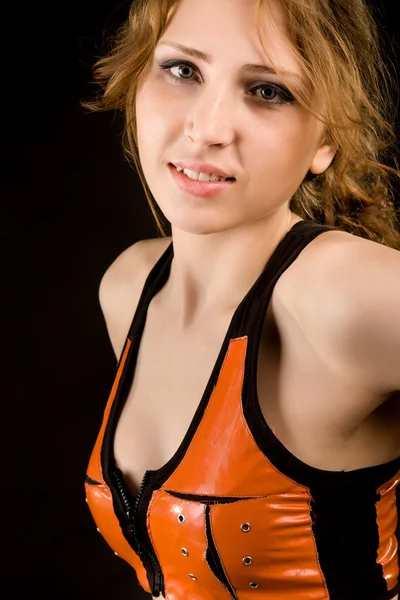 Girl in orange latex suit — Stock Photo, Image