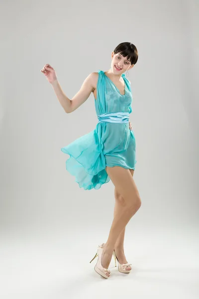 Girl in a turquoise dress — Stock Photo, Image