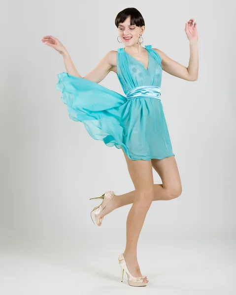 Girl in a turquoise dress — Stock Photo, Image