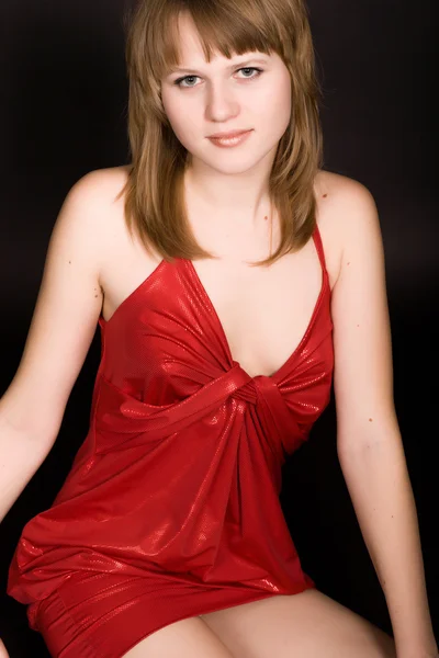 Young girl in a red dress — Stock Photo, Image