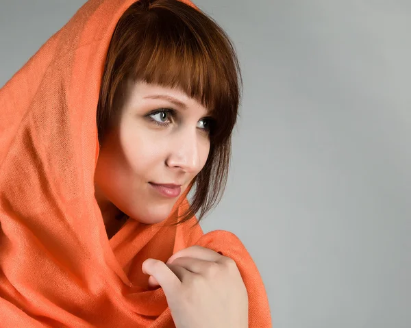 Young brunette woman in a headscarf — Stock Photo, Image