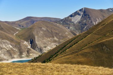 Kazenoy Am. Highland lake on the southern slope of the Andean mountains at an altitude of 1869 metres above sea level - the largest lake by area of the Chechen Republic and the greater Caucasus clipart