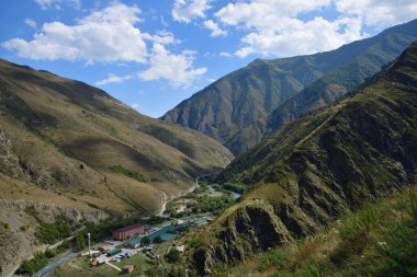 View from above on the Argun river in Caucasus mountains gorge and russian military frontier post. Chechnya. Russia clipart