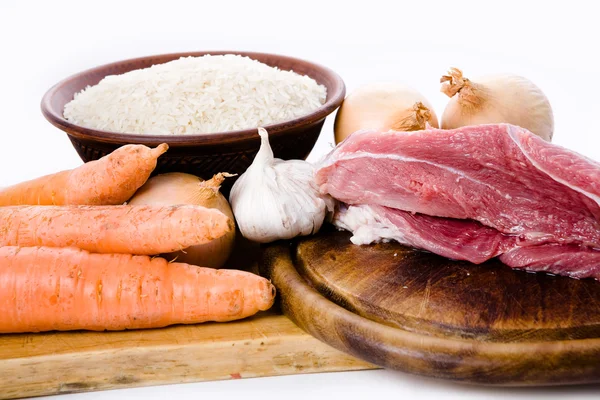 Cenouras, carne, cebola e arroz — Fotografia de Stock