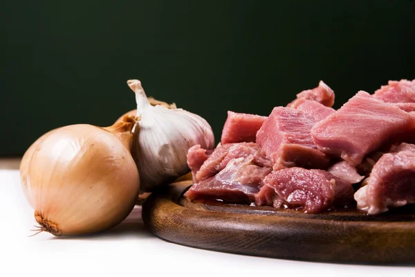 Meat with onions and garlic — Stock Photo, Image