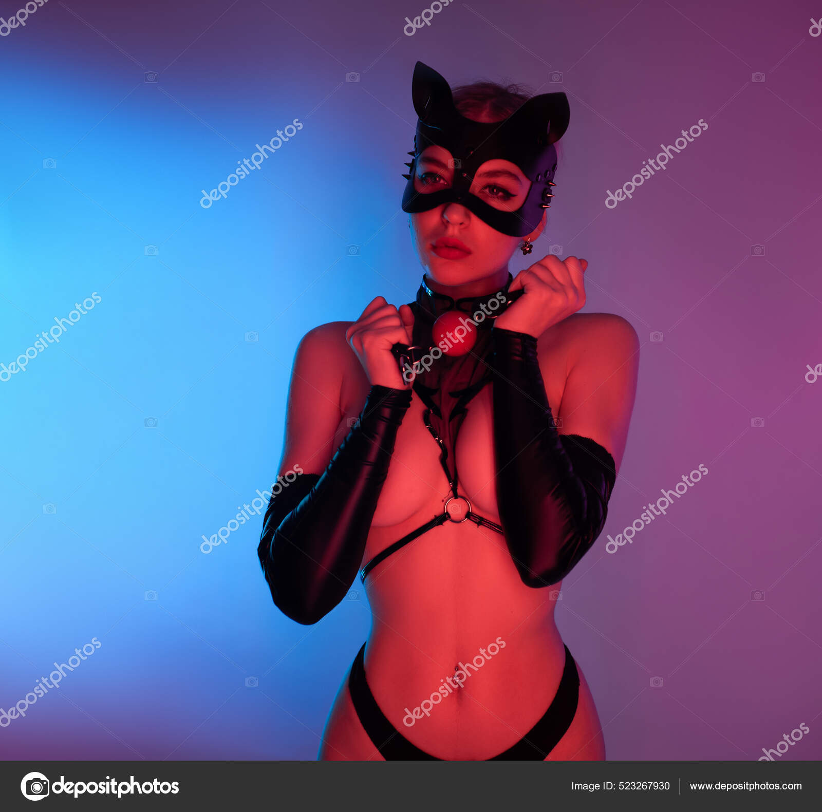 Sexy woman in a leather cat mask with a gag for bdsm sex toys Stock Photo by ©artrotozwork 523267930