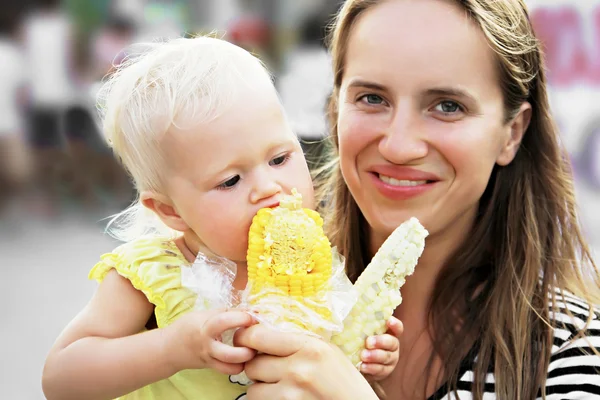 Baby and corn — Stock Photo, Image