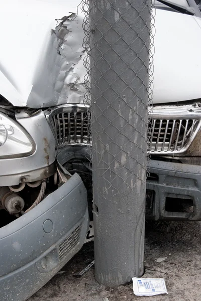 The car as a result of road accident got to column. — Stock Photo, Image