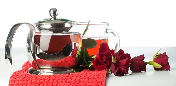 Scalded teapot and cup of tea — Stock Photo, Image