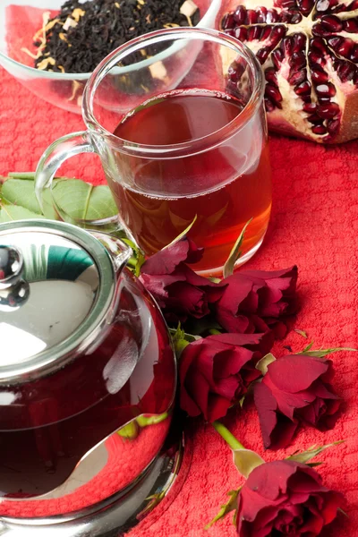 Scalded teapot and cup of tea — Stock Photo, Image