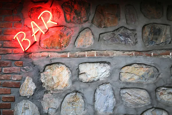 Bar sign on a stone wall — Stock Photo, Image