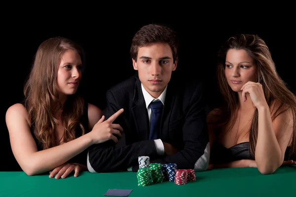 Man and women playing poker Stock Picture