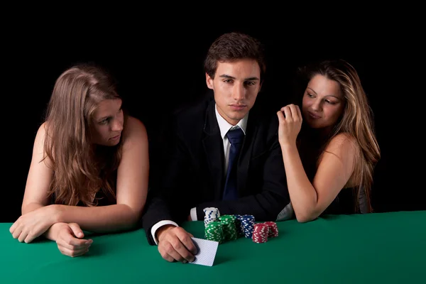 Man and women playing poker Royalty Free Stock Photos