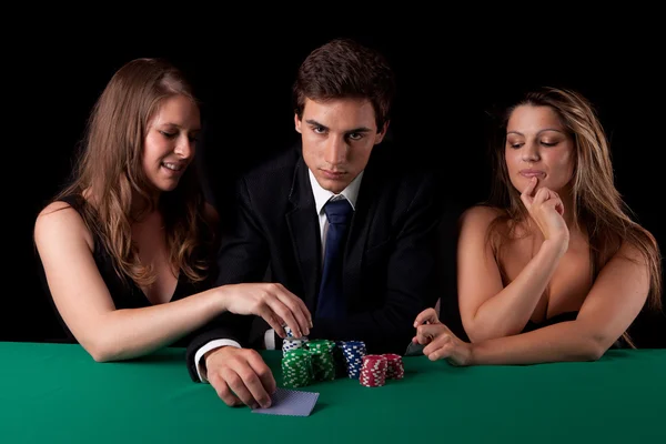 Man and women playing poker Royalty Free Stock Images