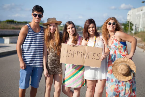 Friends holding a card — Stock Photo, Image