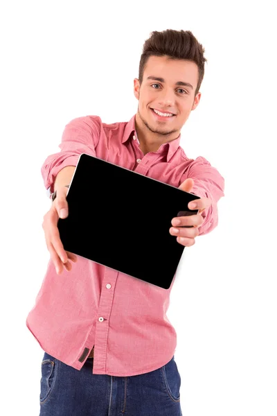 Homem jovem apresentando um computador tablet — Fotografia de Stock