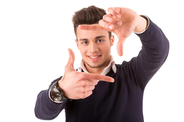 Joven estudiante haciendo enmarcar gesto clave —  Fotos de Stock