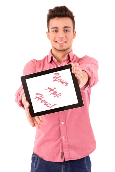 Молодой человек представляет планшетный компьютер — стоковое фото
