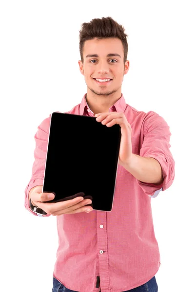Junger Mann hält Tablet-Computer in der Hand Stockbild