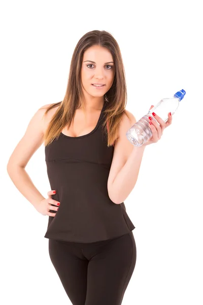 Jovem mulher bonita segurando uma garrafa de água — Fotografia de Stock