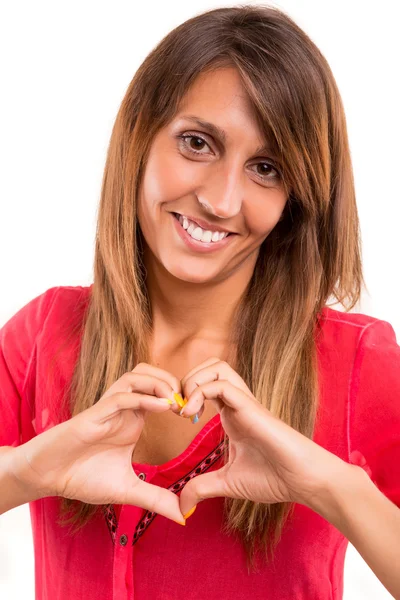 Hermosa mujer haciendo una forma de corazón — Foto de Stock