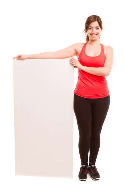 Fitness woman holding blank board — Stock Photo, Image