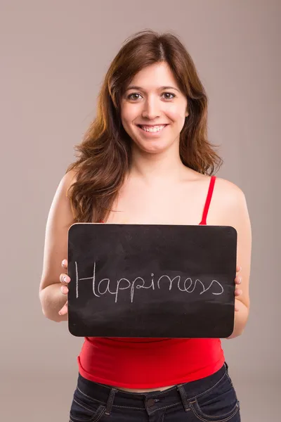 Woman and board with happiness — Stock Photo, Image