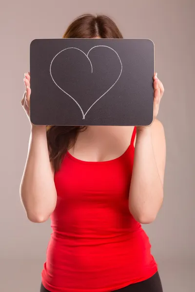 Vrouw met warmte aan boord — Stockfoto