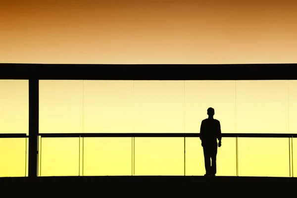 Worker inside the modern building in silhouette — Stock Photo, Image
