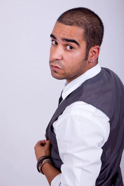 Young business man pensive, on a grey background — Stock Photo, Image