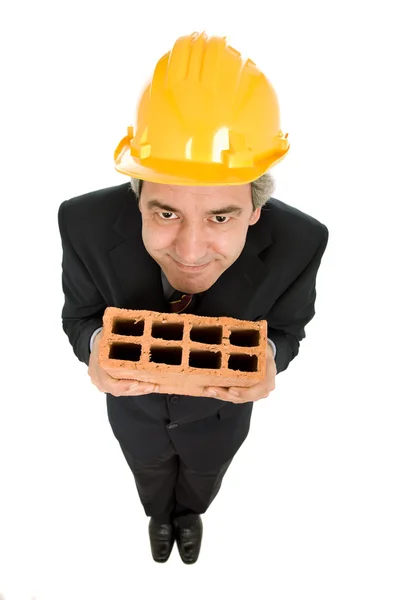 Holding a brick — Stock Photo, Image