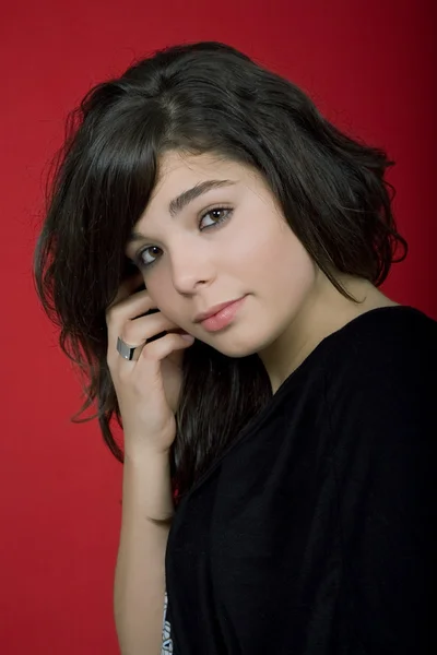 Young woman portrait isolated on red background — Stock Photo, Image