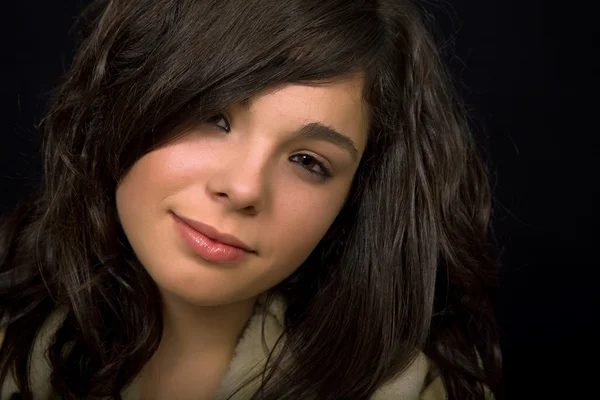 Young beautiful brunette portrait against black background — Stock Photo, Image