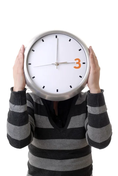 Woman with a clock covering her head — Stock Photo, Image
