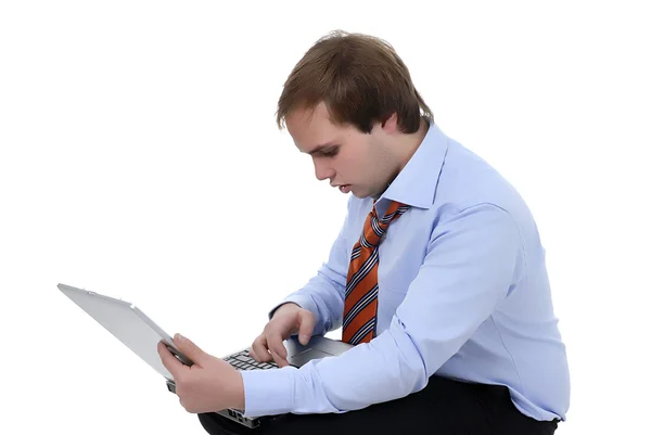 Homem trabalhando com computador em um fundo branco — Fotografia de Stock