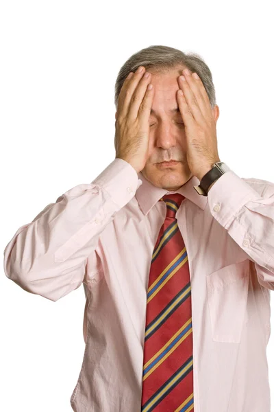 Businessman in a suit gestures with a headache Royalty Free Stock Photos