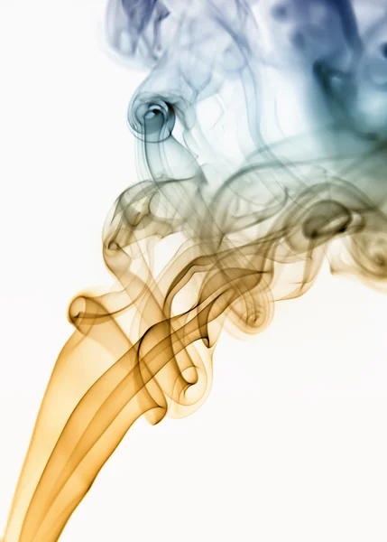 Colored smoke from a cigarrette in white background — Stock Photo, Image