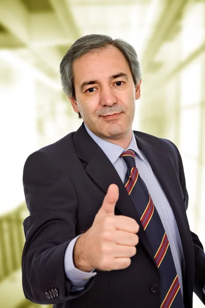 Business man going thumb up at the office — Stock Photo, Image