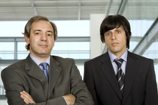 Two young business men portrait, focus on the left man — Stock Photo, Image