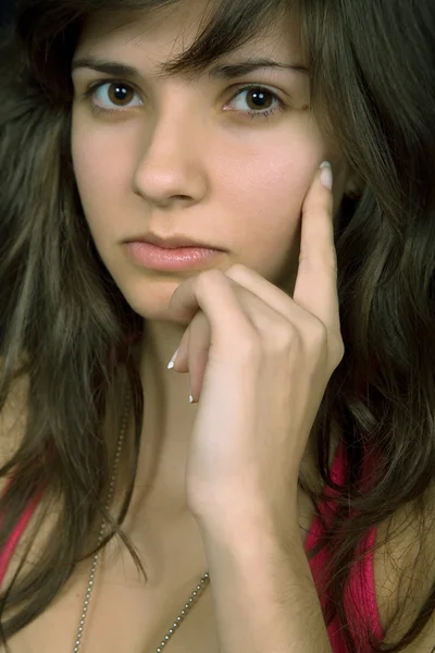 Young beautiful brunette portrait against black background — Stock Photo, Image