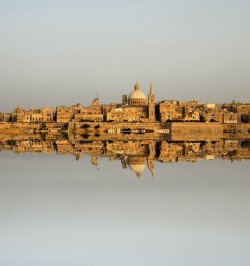 Ancient architecture of malta island with reflection clipart